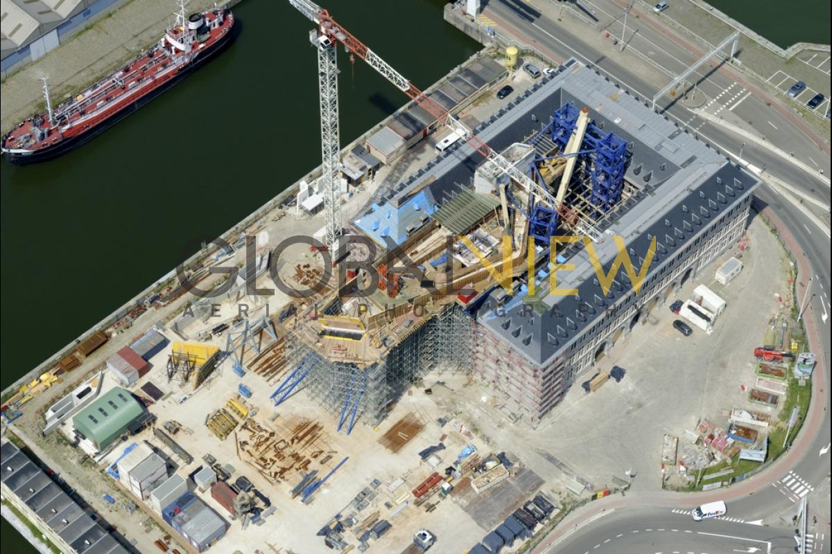 Maison du Port d'Anvers, Havenhuis Antwerpen, Suezdok - Chantier en Juillet 2014. Zaha Hadid Architects