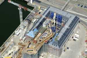 Maison du Port d'Anvers, Havenhuis Antwerpen, Suezdok - Chantier en Juillet 2014. Zaha Hadid Architects